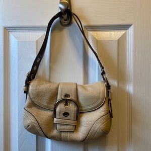 Tan coach bag with original duster bag and box.